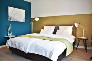 Postel nebo postele na pokoji v ubytování Hotel zum See garni