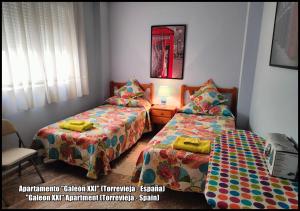 Łóżko lub łóżka w pokoju w obiekcie Apartamento Galeon XXI