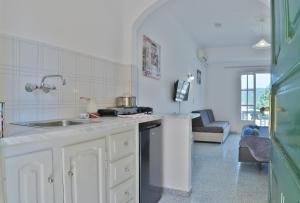 a kitchen with a sink and a counter top at Fotini Studios in Paleokastritsa
