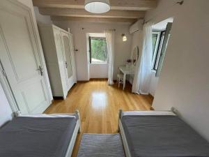 Posteľ alebo postele v izbe v ubytovaní White Orchard