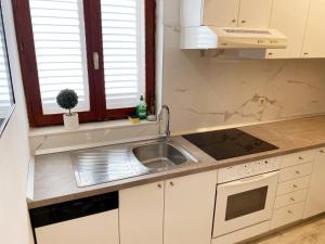 Kuchyň nebo kuchyňský kout v ubytování Apartman Beus
