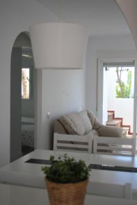 a living room with a couch and a table at Apartamentos Torrelaguna in Vera
