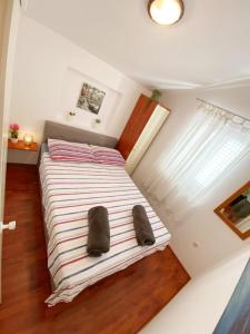 Postel nebo postele na pokoji v ubytování Apartman Beus