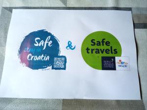 a white piece of paper with stickers on it at Apartment Buic in Pula