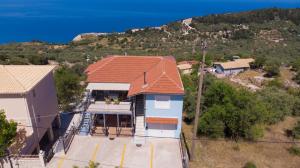 an overhead view of a house with a red roof at Elena Studios in Athani