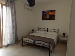 Postel nebo postele na pokoji v ubytování B&B SAINT LOUIS