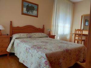 Ένα ή περισσότερα κρεβάτια σε δωμάτιο στο Casa Alfredo