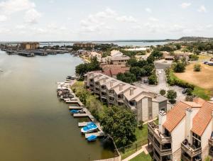 an aerial view of a marina with boats in the water at Lakeside Family Condo Near Horseshoe Bay Resort in Horseshoe Bay