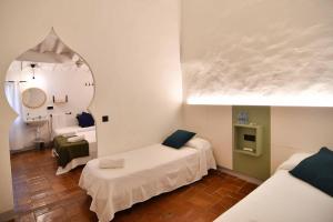 Postel nebo postele na pokoji v ubytování Hostal l'Estrella