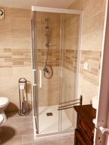 a shower with a glass door in a bathroom at Rodi Garganico in Foce Varano +31 photos