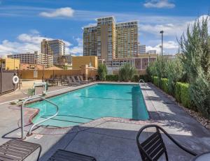 a park with a pool, chairs, and a bench at WorldMark Reno in Reno