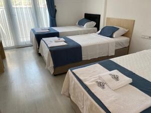 Postel nebo postele na pokoji v ubytování Nefis Hotel Ölüdeniz