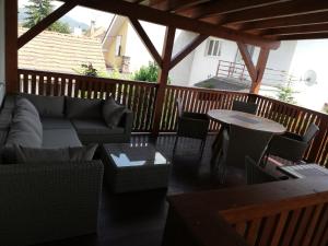 a patio with a couch and chairs and a table at CENTRO in Štúrovo
