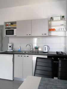Кухня или мини-кухня в Apartment "MANNA
