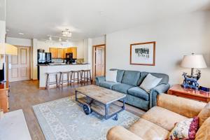 a living room with a couch and a table at Ski In Out Luxury Condo #1221 With Hot Tub & Great Views - 500 Dollars Of FREE Activities & Equipment Rentals Daily in Winter Park