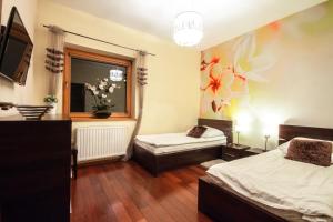 Posteľ alebo postele v izbe v ubytovaní ApartSerwis Gorące Źródła - Apartament Kozi Wierch
