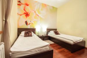 Posteľ alebo postele v izbe v ubytovaní ApartSerwis Gorące Źródła - Apartament Kozi Wierch