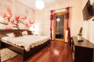 Posteľ alebo postele v izbe v ubytovaní ApartSerwis Gorące Źródła - Apartament Kozi Wierch