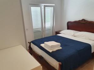 En eller flere senger på et rom på Apartments Costa Rica