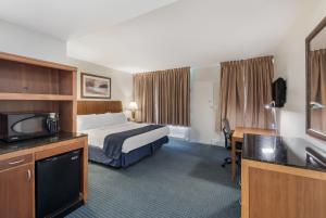 Ένα ή περισσότερα κρεβάτια σε δωμάτιο στο Americas Best Value Inn-Painted Post +15 φωτογραφίες
