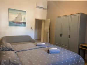 a bedroom with a bed and a painting on the wall at Parentium town center in Poreč