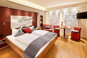 Postel nebo postele na pokoji v ubytování Hotel Weinbauer