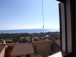 a view of the ocean from the roof of a building at Panoramicissima in Costa Rei