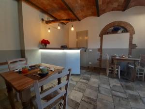 Reštaurácia alebo iné gastronomické zariadenie v ubytovaní Agriturismo Poggio Ridulfo
