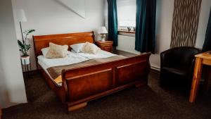 Uma cama ou camas num quarto em Browar Osjann - pokoje gościnne