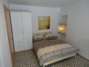 Postel nebo postele na pokoji v ubytování Haus Wangen Studio