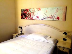 A bed or beds in a room at Hotel Sextum