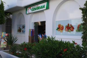 a store with a sign that reads cevallan at Apartamentos Torrelaguna in Vera