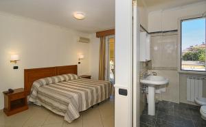 Koupelna v ubytování Hotel Coluccini