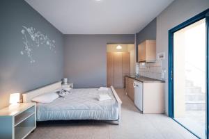 Postel nebo postele na pokoji v ubytování Philyra appartments