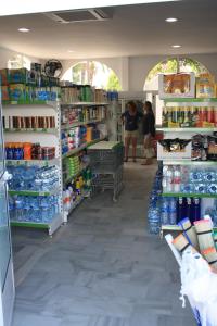 a store with people standing in the aisle at Apartamentos Torrelaguna in Vera