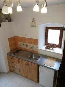 a kitchen with a sink and a window at Studio Kairos in Trogir +66 photos