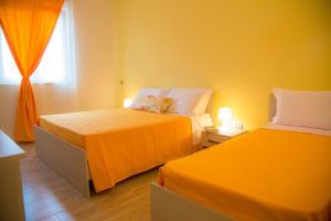 Postel nebo postele na pokoji v ubytování Messapia Casa Vacanze