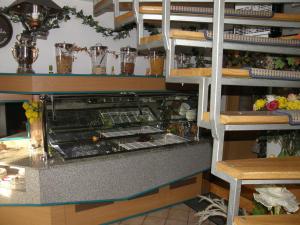 a kitchen with a counter with some food at Gościniec pod Różą in Chełmno