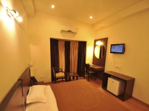 Voodi või voodid majutusasutuse Hotel Hong Kong Inn toas