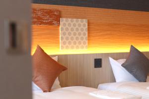 Postel nebo postele na pokoji v ubytování KOKO HOTEL Tsukiji Ginza