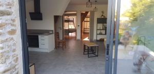 a view of a kitchen and a living room at Chez Marcel Gite PMR in La Marne