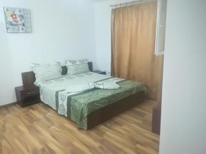 Ένα ή περισσότερα κρεβάτια σε δωμάτιο στο Vila Popoiu