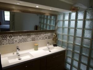 a bathroom with two sinks and a mirror at chambre campagnarde in Bargème +71 photos