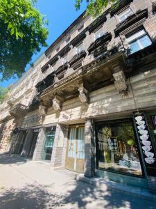 a store front of a building on a street at OPERA16 Guestrooms in Budapest