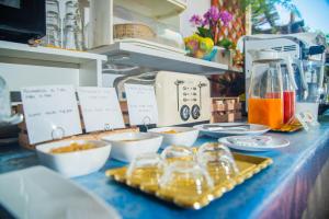 a table with bowls of food and a blender at B&B Ravello Rooms in Ravello