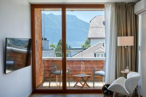 TV a/nebo společenská místnost v ubytování Hotel Rössli Gourmet & Spa