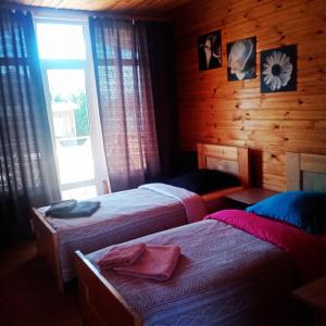 Кровать или кровати в номере Holiday Park on Olkhon