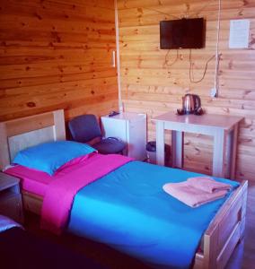 Кровать или кровати в номере Holiday Park on Olkhon