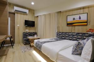 Letto o letti in una camera di Hotel Elysian Residency