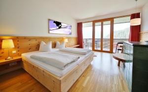 Postel nebo postele na pokoji v ubytování Hotel Pension Geiger